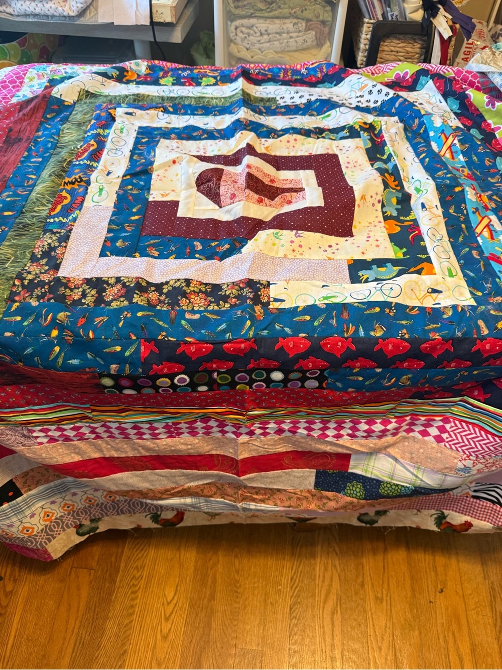 Handmade scrappy Log Cabin pattern quilt top.